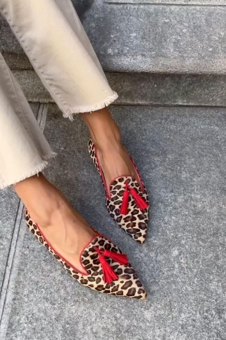 SAVINA | Elegant pointed-toe loafers with fringe details for a refined look